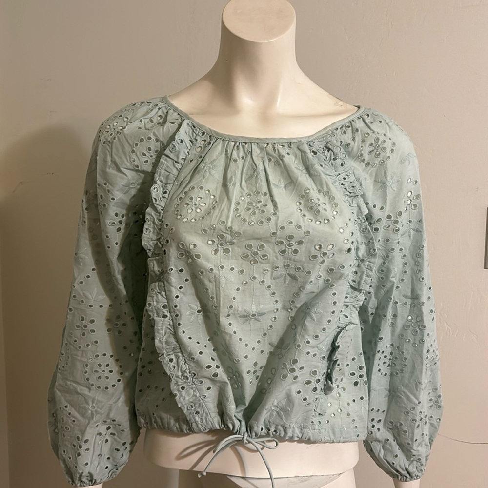 Eyelet ruffled tie front top